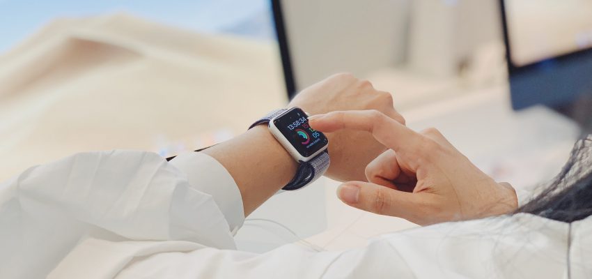 Woman using smart watch, wearable technology product
